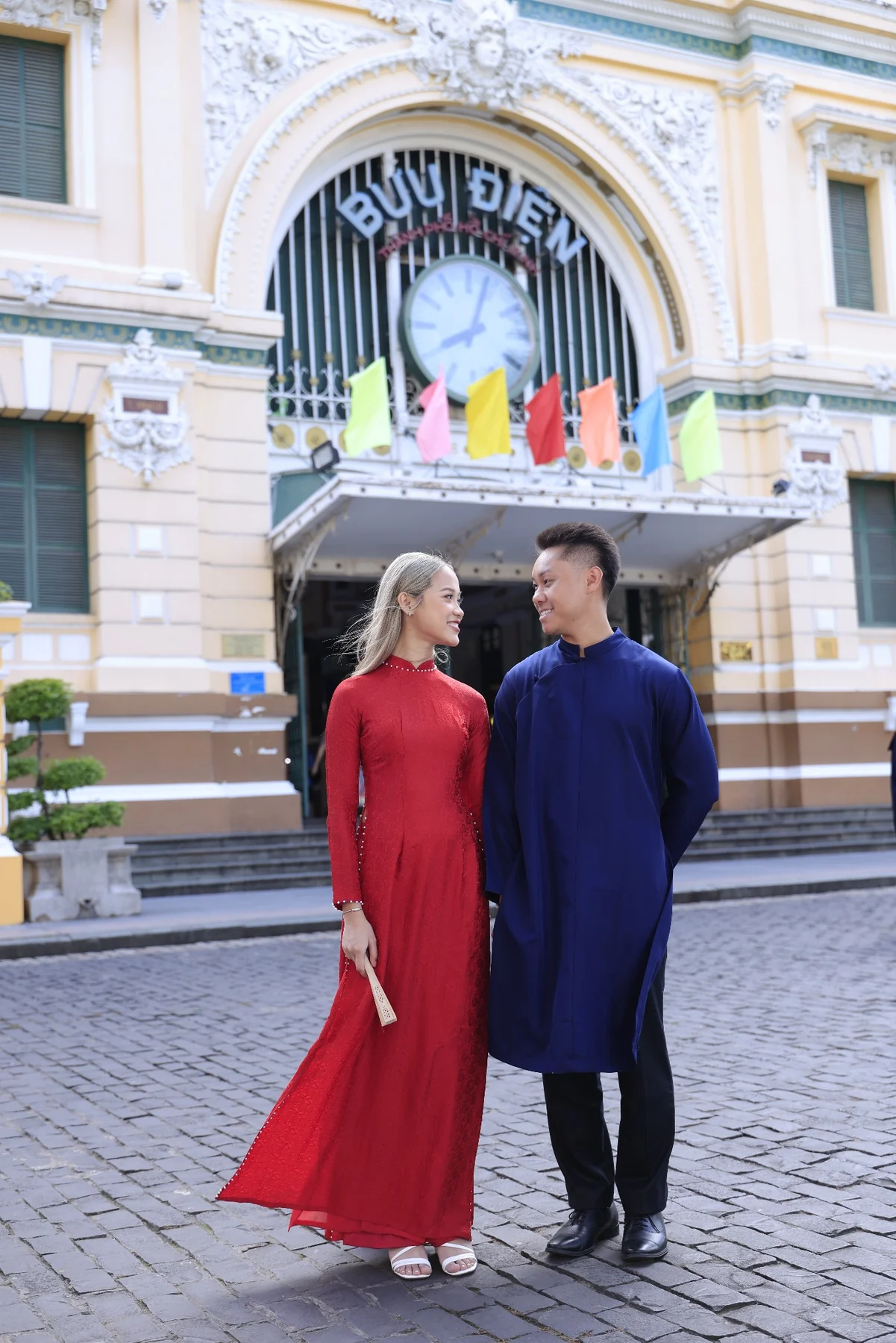 Huyen and Ryan wearing traditional Vietnamese áo dài