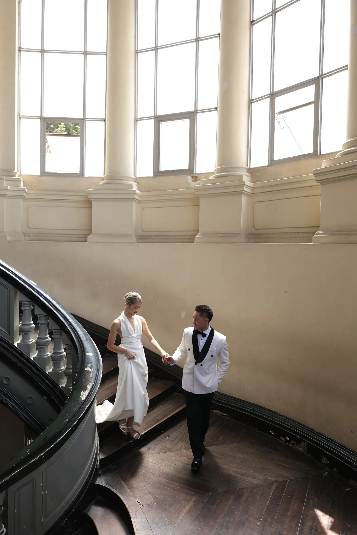 Huyen and Ryan walking down the grand staircase